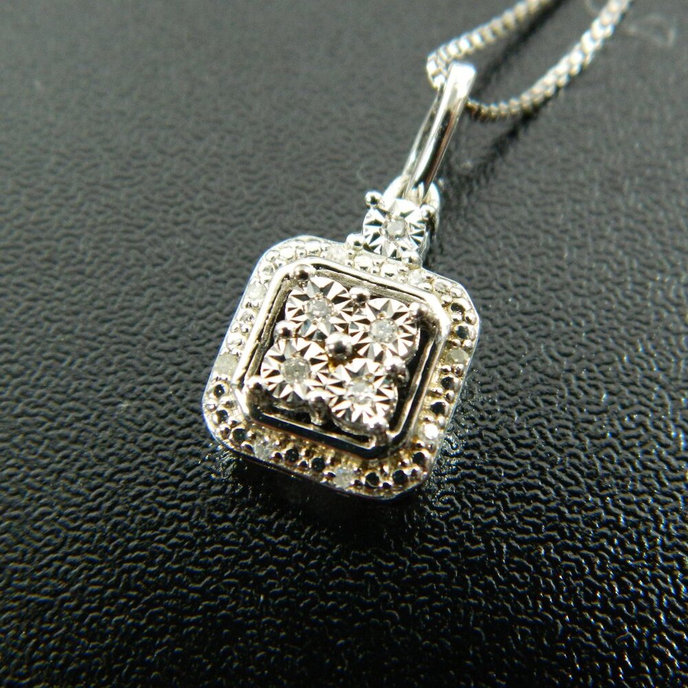 Diamond Blossom Necklace Diamonds set in Sterling Silver appx 1/20ctw